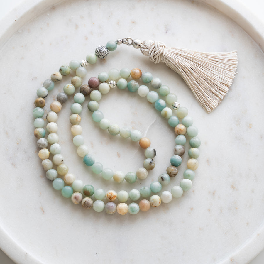 Amazonite tasbih (misbaha) with 99 natural amazonite beads, silver separators and a cream tassel on white marble