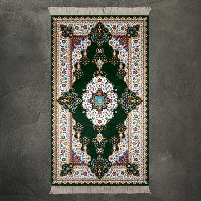 Blossom prayer mat in green with a floral medallion and a cream floral border, full view #color_green