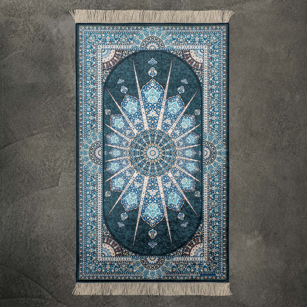 Blue Eye prayer mat with a teal star medallion and cream fringe, full view